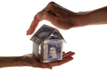paper house in hands