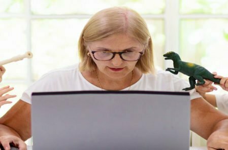 mother and children at home on laptop