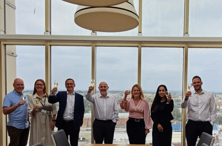 Staff drinking champagne at new Paris Smith Bournemouth office